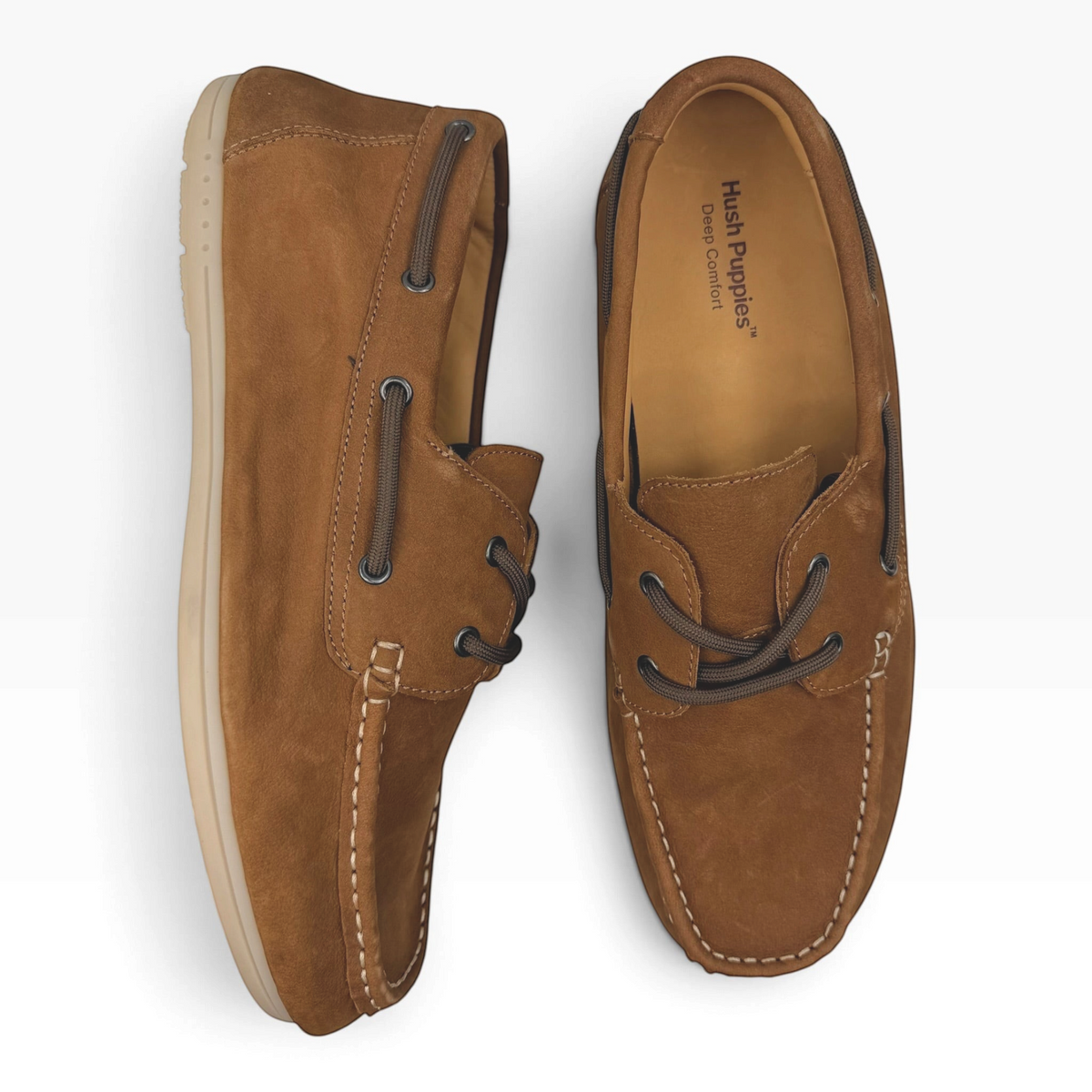 The Shoe Shop Fen boat shoe in brown nubuck leather with moccasin stitching, rawhide laces, and rubber sole.