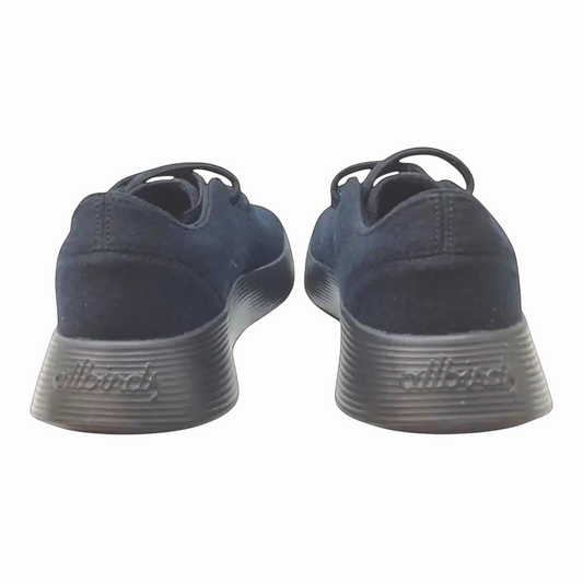 The Shoe Shop Allbirds Wool Runner mens sneakers in black, showing the rear view of the merino wool upper and soles.