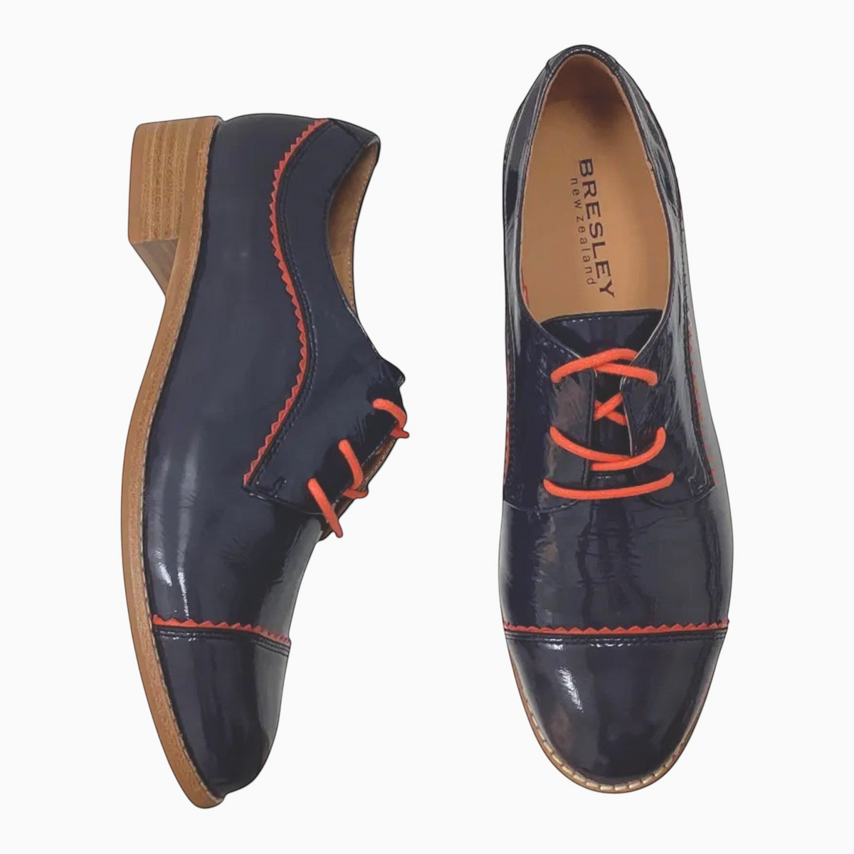 The Shoe Shop Alpopo navy patent leather lace-up flats with orange accents and a low block heel