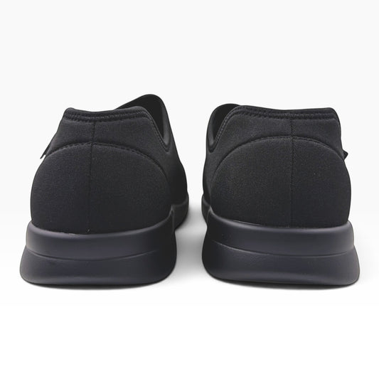 The Shoe Shop Cush n Foot M 5E black neoprene slippers viewed from the back showing the durable PU outsole