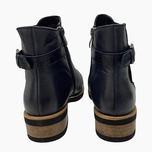 The Shoe Shop Deonte navy leather ankle boots featuring a croc-textured strap, buckle detail, and stacked heel.