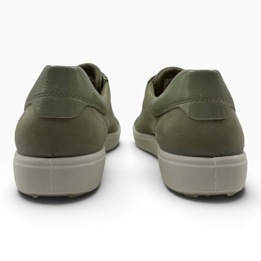 Back view of The Shoe Shop Ecco Soft 7 sneakers in tea green suede with a glossy heel detail and beige rubber sole.