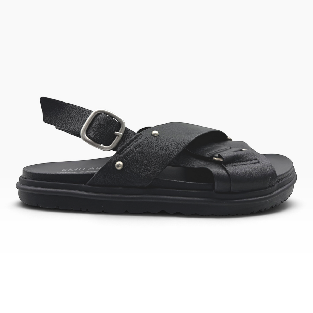 The Shoe Shop Faye leather sandal in espresso with crossed straps, adjustable heel buckle, and ridged rubber sole.