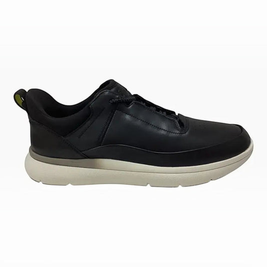The Shoe Shop Florsheim Fortress black leather low-top sneaker with a thick white cushioned sole and heel pull tab.