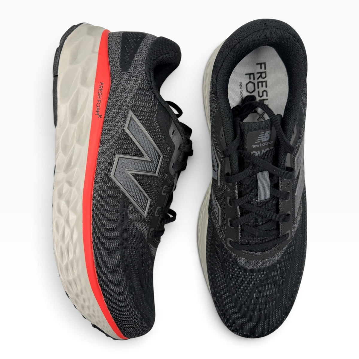 The Shoe Shop Fresh Foam X EVOZ V4 running shoe in black with red accents and breathable engineered mesh upper.