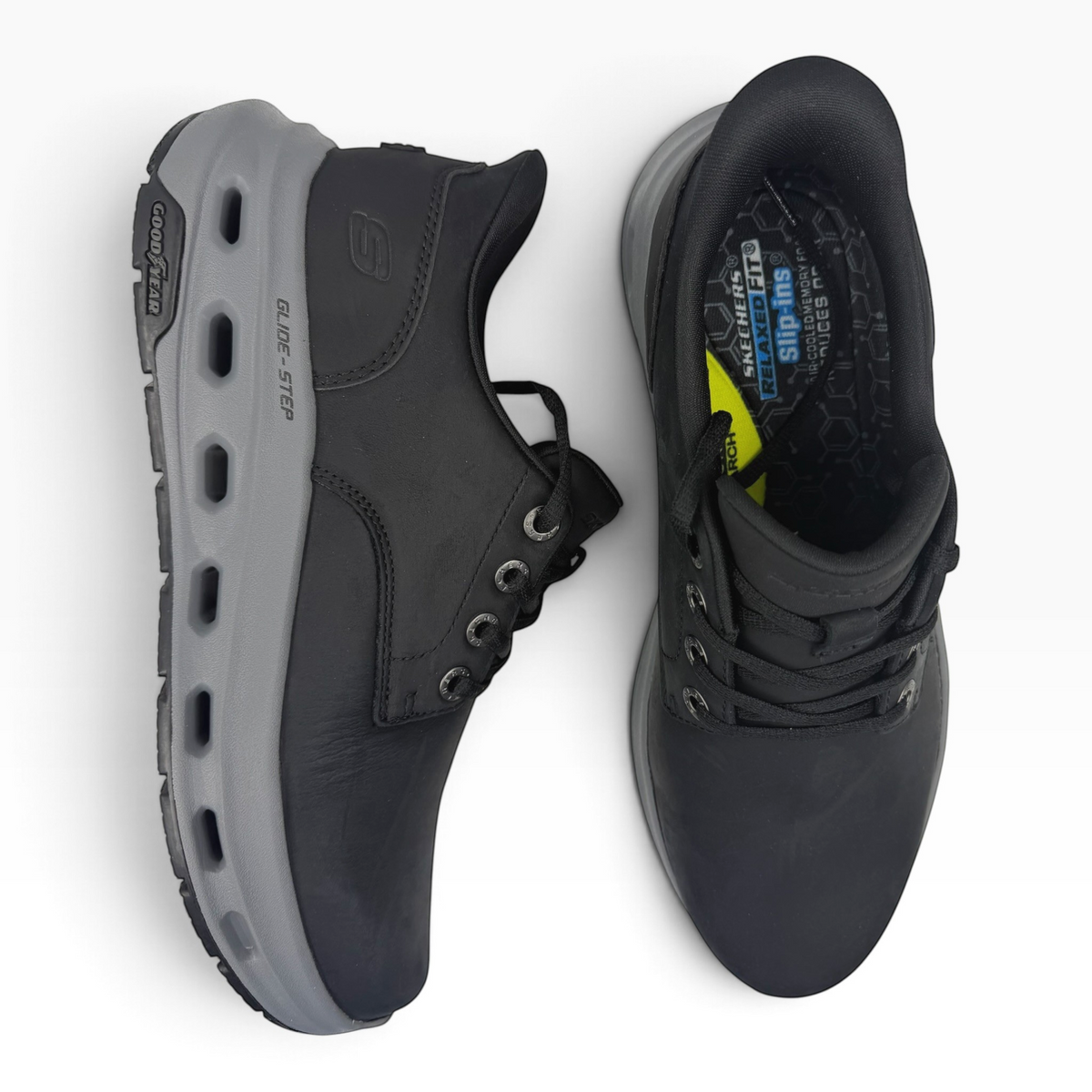 The Shoe Shop Glide Step Cade Ox black leather sneakers with grey Goodyear performance outsoles, top-down view.