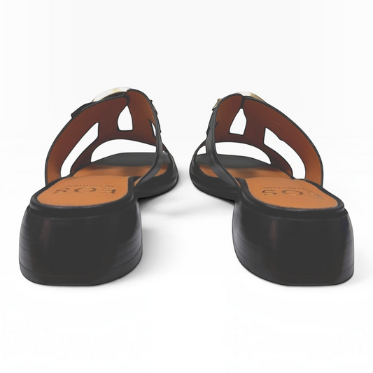 The Shoe Shop Ikami black leather slide sandals with a low block heel and cutout strap detail viewed from the back