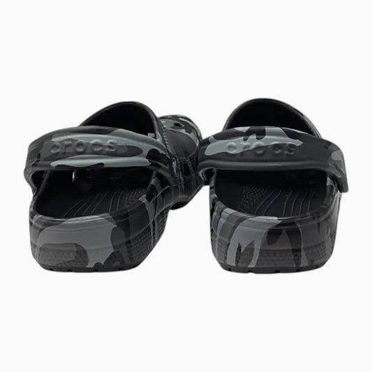 The Shoe Shop kids Crocs Classic Clogs in a grey and black camo print with pivoting heel straps, rear view.