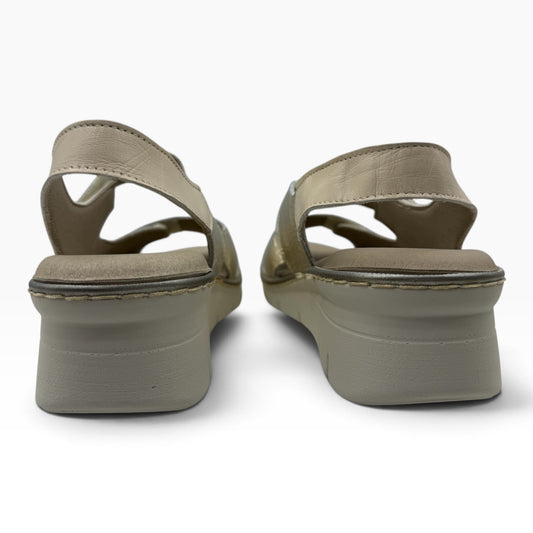 The Shoe Shop 11010 Pitillos sandals in beige leather with a comfortable wedge heel, back view.