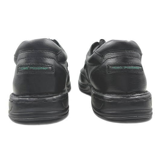 The Shoe Shop Randall II black leather walking shoes showing the cushioned heel and Hush Puppies branding from behind.