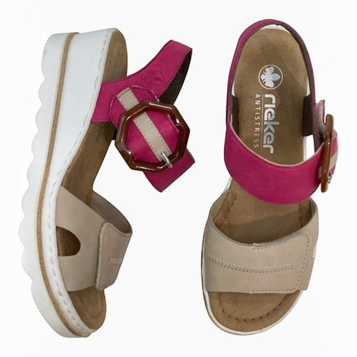 The Shoe Shop Rieker Whitney wedge sandals in pink and beige synthetic material with an octagonal buckle ankle strap.