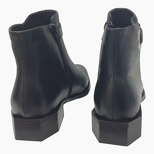The Shoe Shop Roberta black leather ankle boots featuring a unique hexagonal block heel and side zip closure.