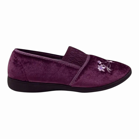 The Shoe Shop Sasha plush purple velvet slipper with floral embroidery and a low-profile black indoor sole