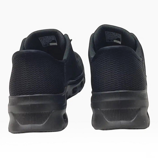 The Shoe Shop Skechers Glide Step Pro black mesh sneakers showing the rear heel view with geometric cushioned soles.