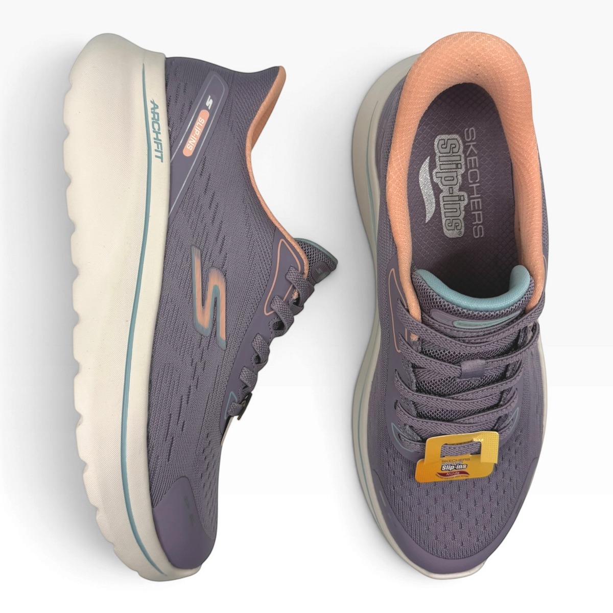 The Shoe Shop Skechers Go Walk Arch Fit N Joy purple mesh slip-in sneakers with peach lining and cushioned midsole.