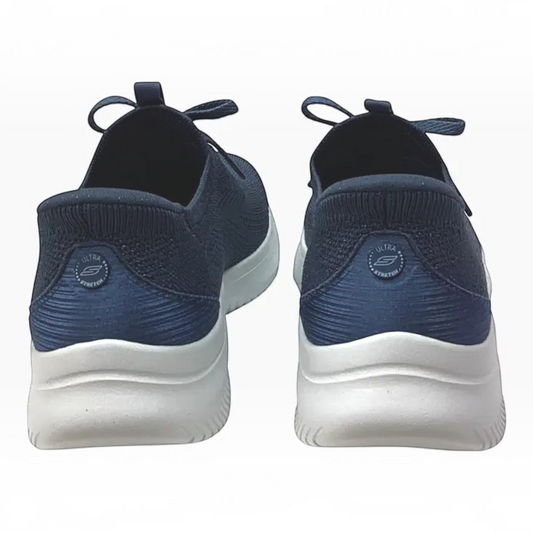 The Shoe Shop Skechers Ultra Flex 4.0 navy blue slip-on sneakers with white cushioned soles and heel pillow detail.