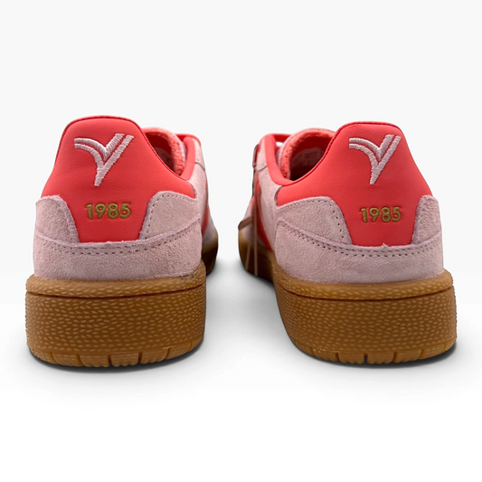 The Shoe Shop Smash Sneaker in Rosa suede with red heel tab, 1985 embroidery, and textured gum rubber sole.