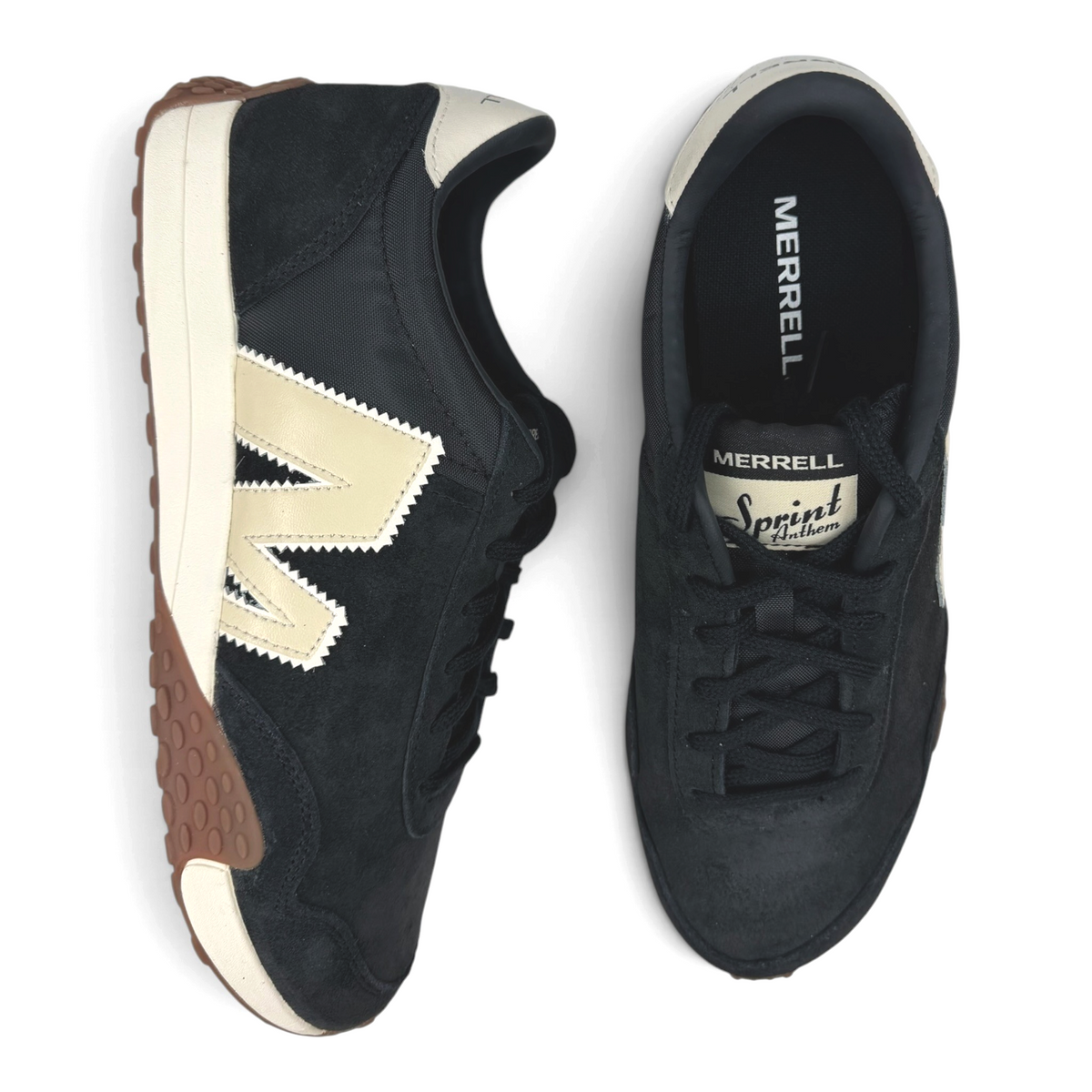 The Shoe Shop Sprint Anthem sneaker in black suede and mesh with a cream logo and gum-rubber outsole, top view.