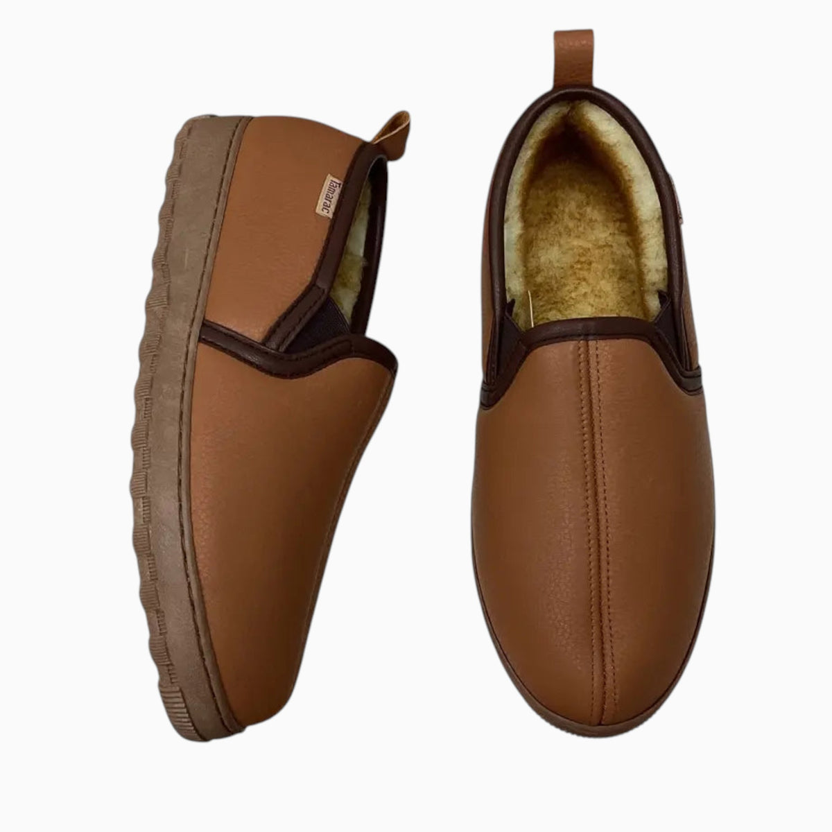 The Shoe Shop Tamarac deerskin slippers in tan leather with warm fleece lining and durable non-slip rubber outsoles.