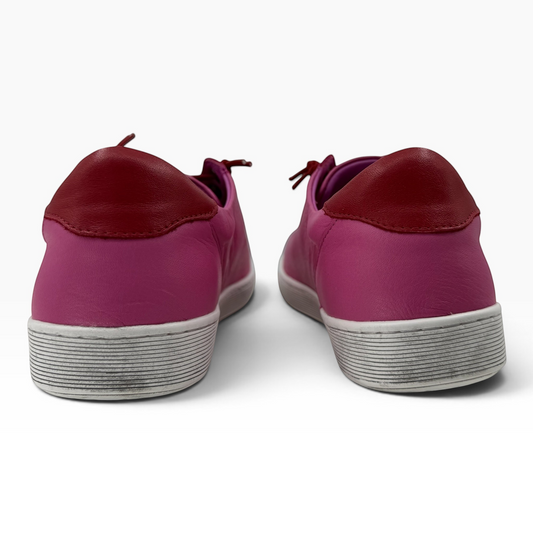 The Shoe Shop Rilassare Temi pink leather sneakers with dark red heel detail and white textured soles, rear view.