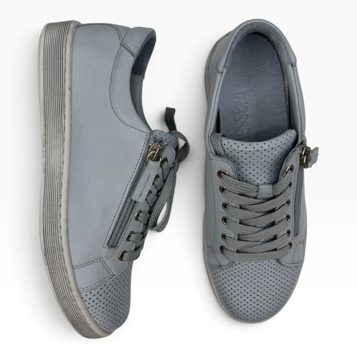 The Shoe Shop Tommie Perf grey leather sneakers with perforated detailing, side zip, and lace-up closure.