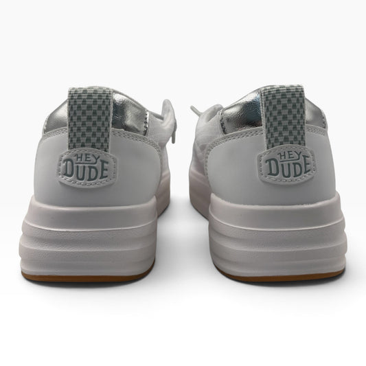 The Shoe Shop Wendy Nova Knit white sneakers featuring silver metallic heel accents and Hey Dude branding on the back.