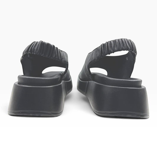 The Shoe Shop Zootie black platform sandals with elasticated slingback straps viewed from the back