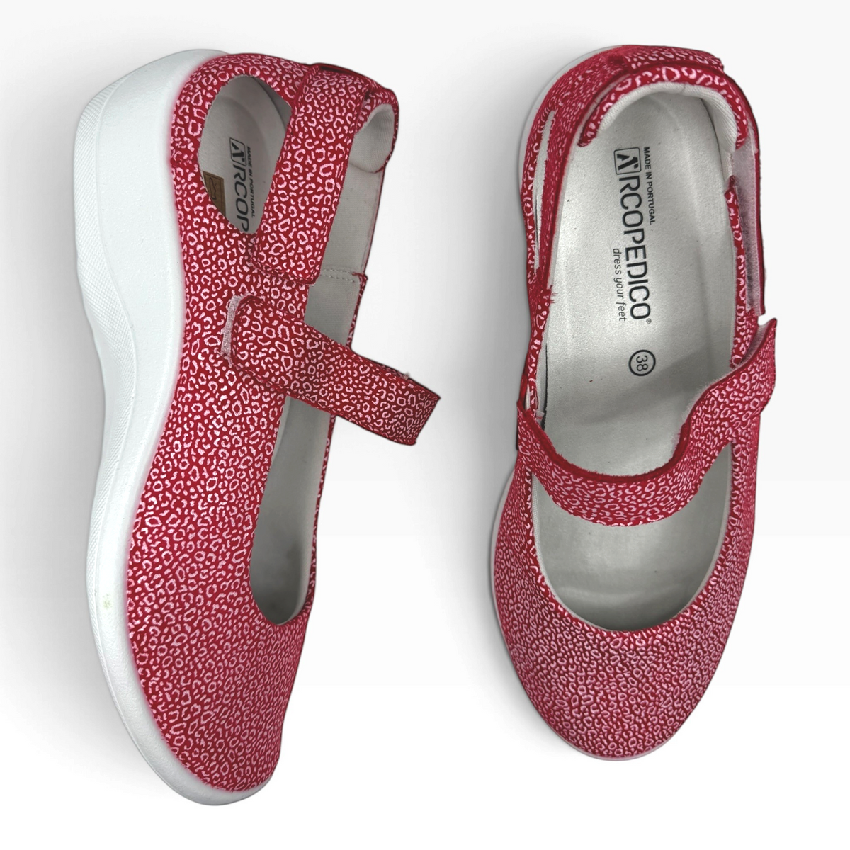 The Shoe Shop Minami red leopard print Mary Jane comfort shoes with adjustable Velcro straps and white wedge soles.