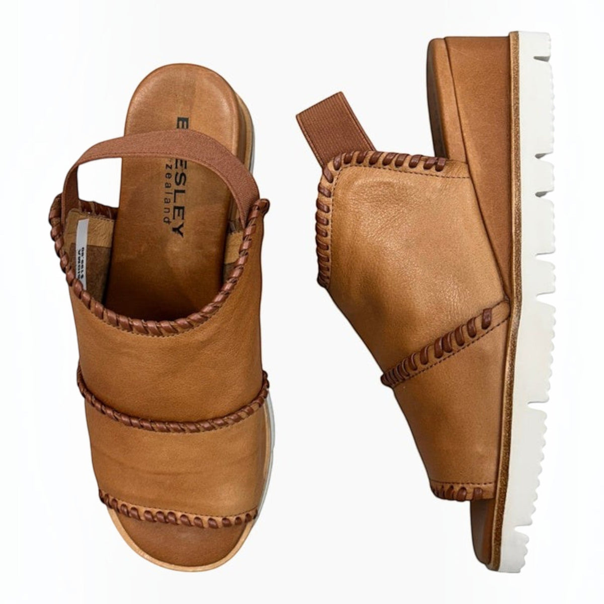 The Shoe Shop Sigma tan leather wedge sandals with contrast whipstitch detailing and elasticated slingback straps.