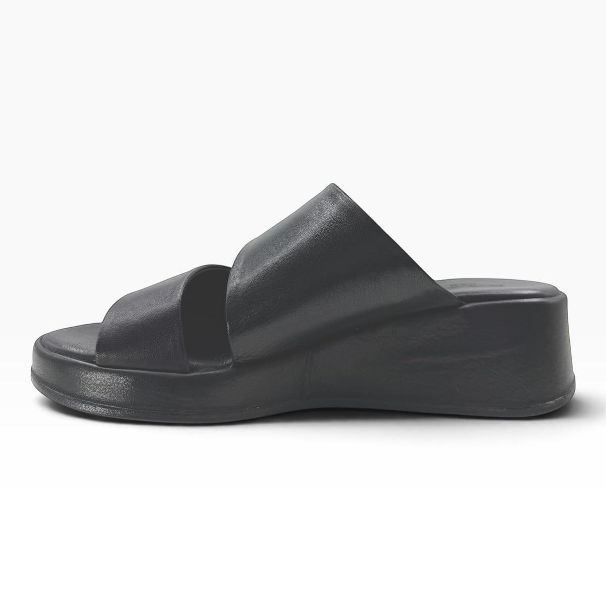 The Shoe Shop Parisa black leather wedge slide sandal with a comfortable platform sole and slip-on design.