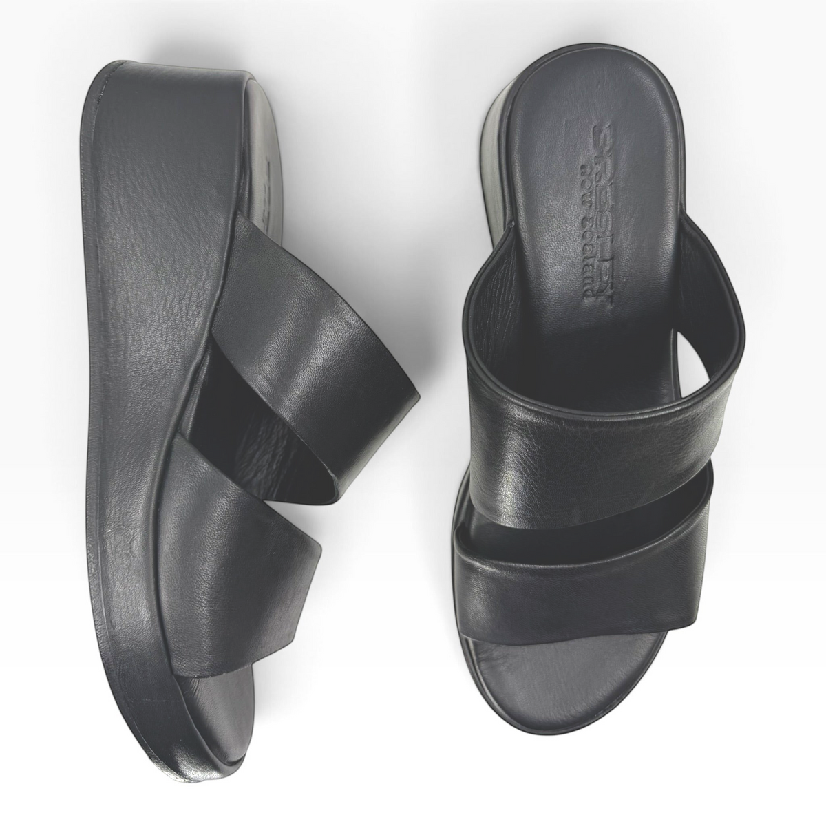 The Shoe Shop Parisa black pebbled leather wedge slide sandals with a comfortable padded footbed.