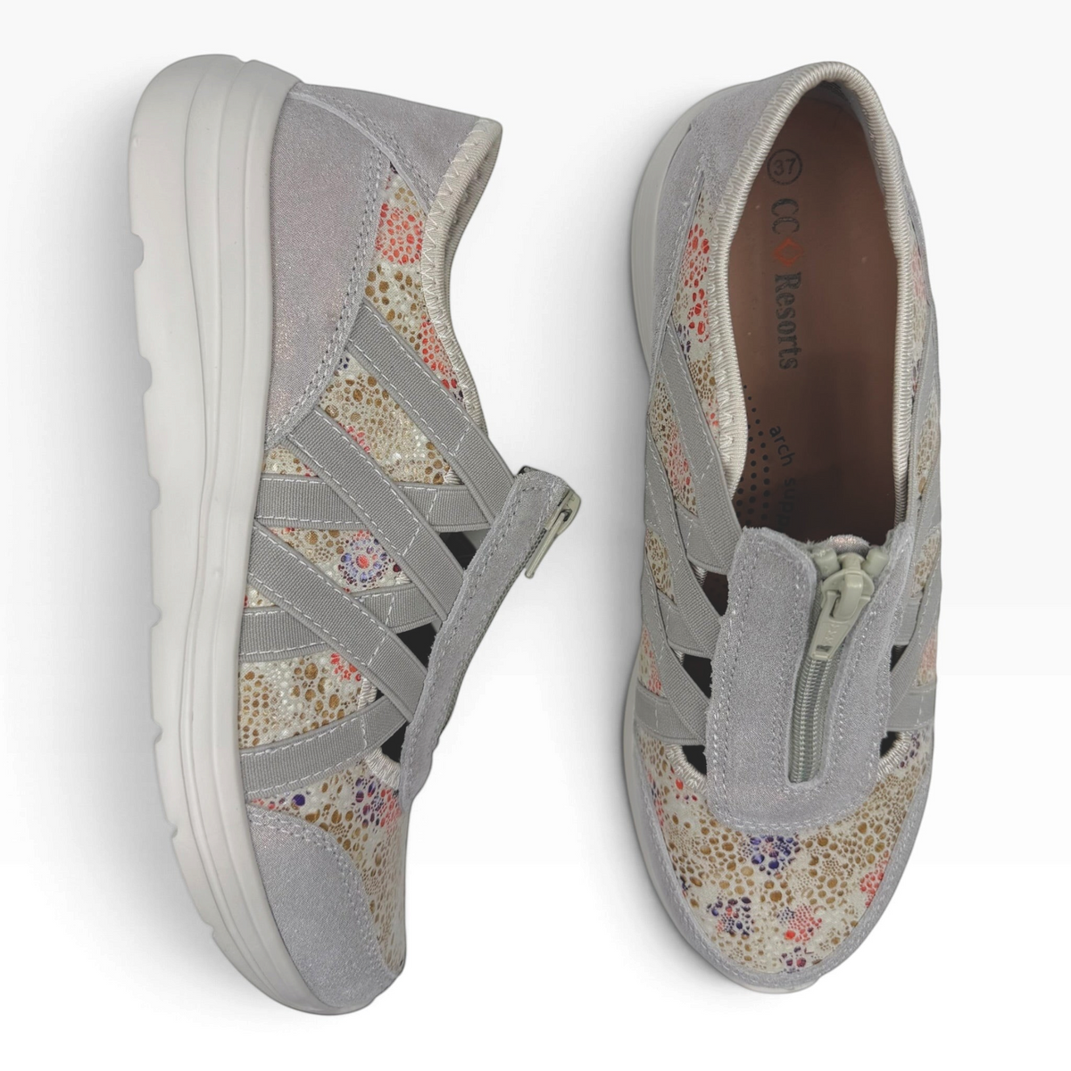 The Shoe Shop Callum Casual Flat in grey suede with floral textile panels, elasticated cross-straps, and front zip.
