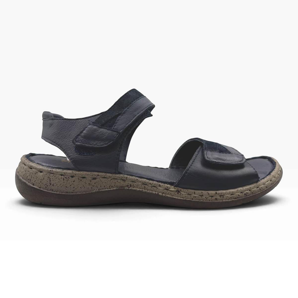 The Shoe Shop Meteor Sandal in navy leather and suede with adjustable Velcro straps and a cushioned footbed.