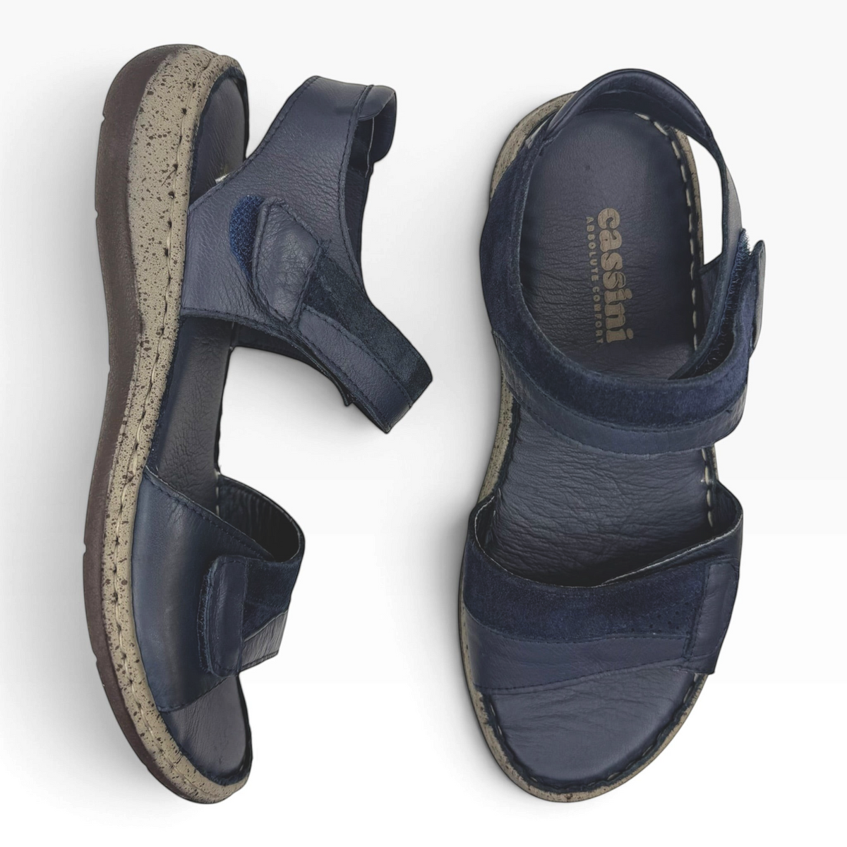 The Shoe Shop Meteor navy leather and suede sandals with adjustable Velcro straps and cushioned footbeds.