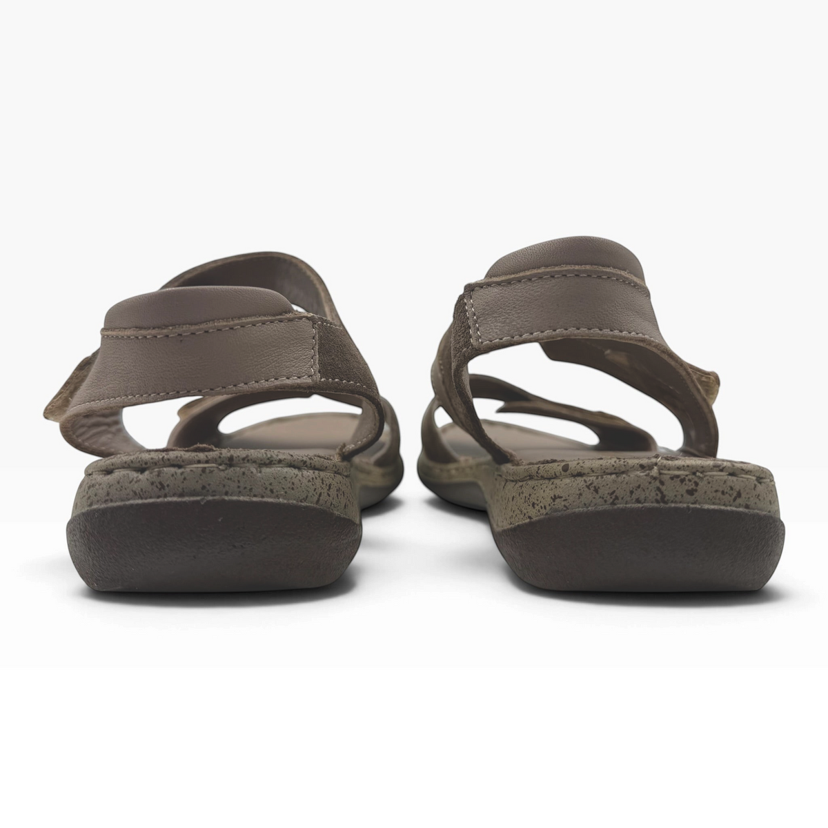 The Shoe Shop Meteor Sandal in brown leather and suede with adjustable straps and a cushioned, textured sole.