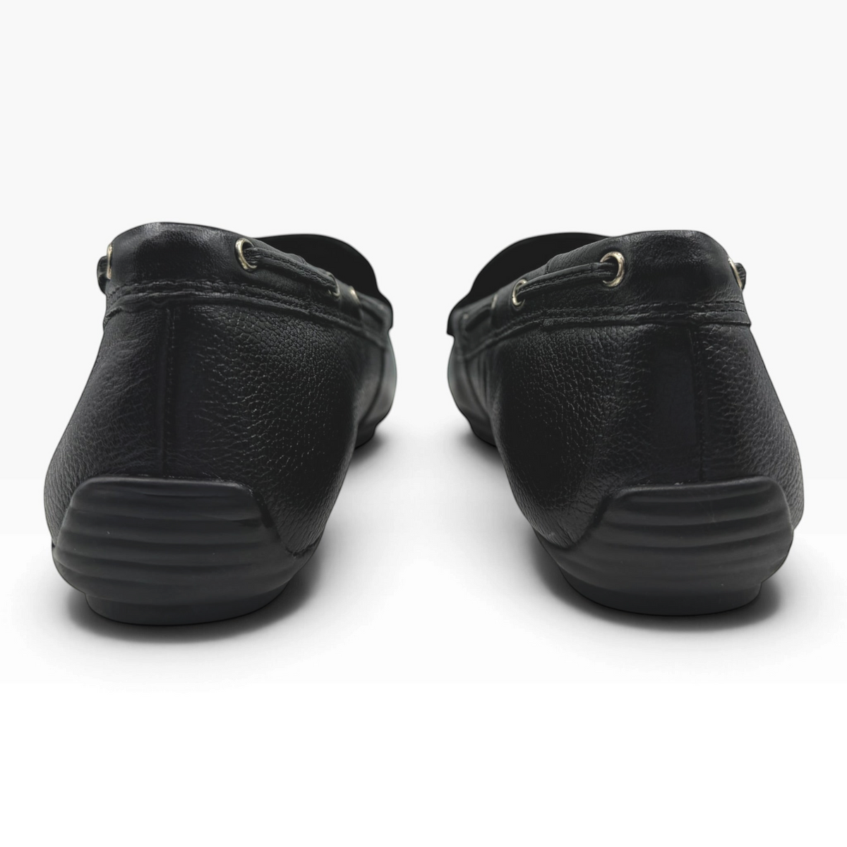 The Shoe Shop 24630 black leather loafers featuring a flexible rubber driving sole and rear heel grip detail.