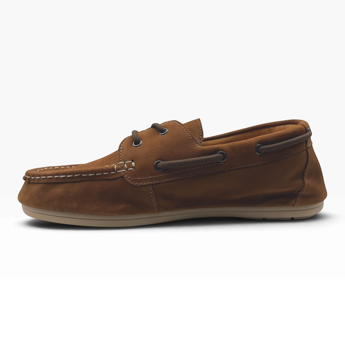 The Shoe Shop Fen boat shoe in brown nubuck leather with moccasin stitching and rawhide lacing, side profile view.