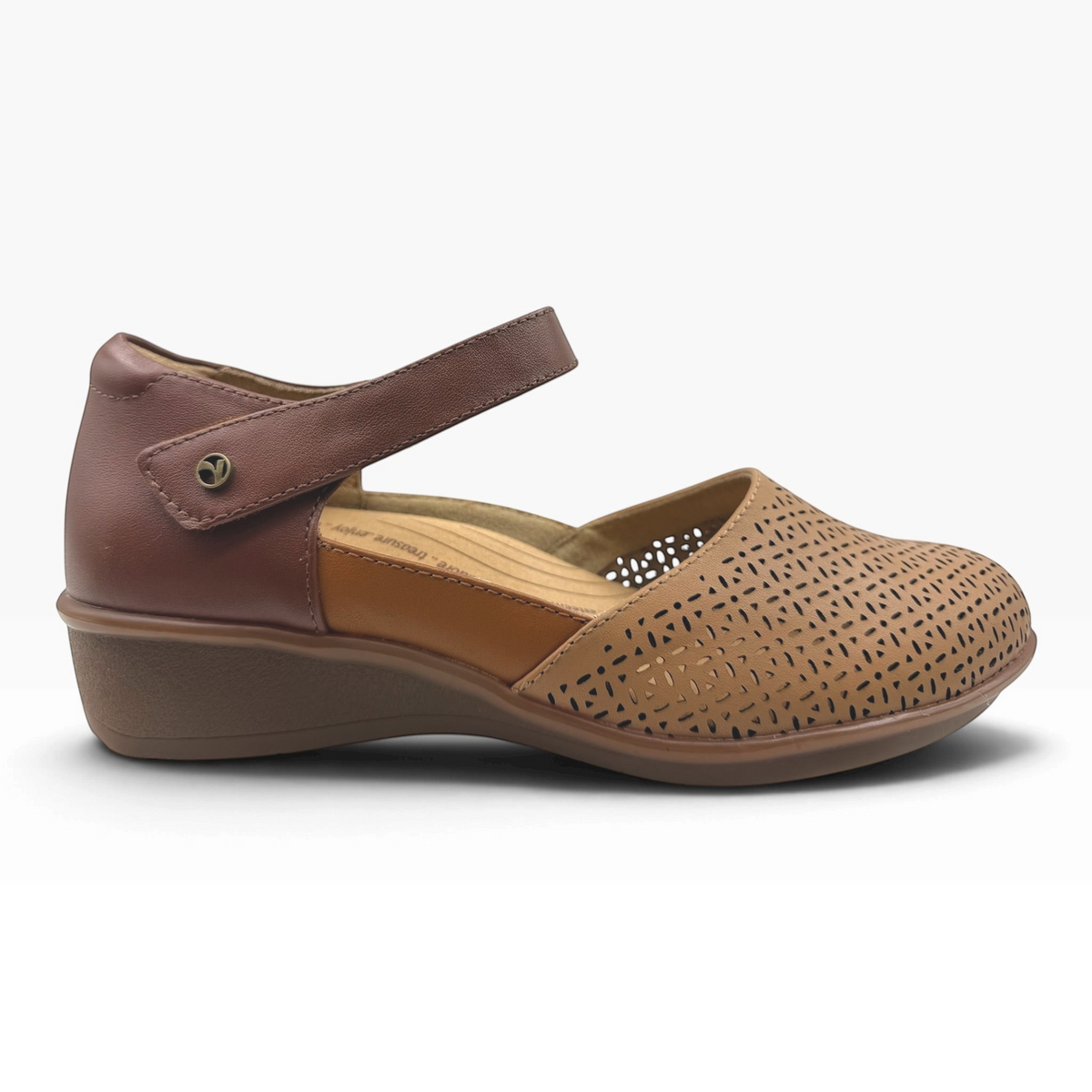 The Shoe Shop Osaka Wide Sandal in tan perforated leather with an adjustable ankle strap and low wedge heel.
