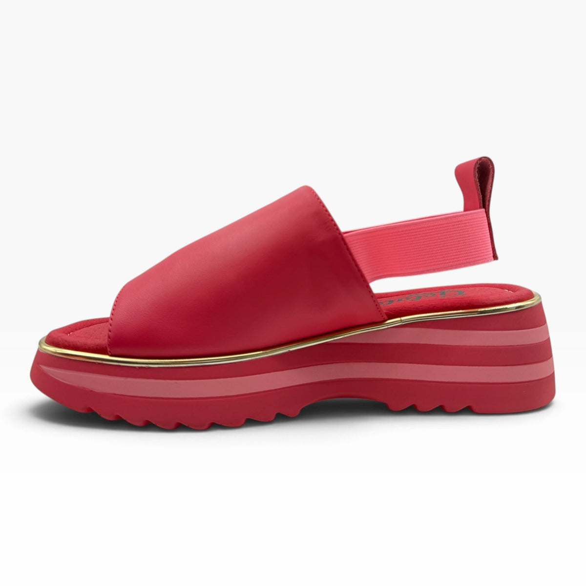The Shoe Shop Gisborne red leather platform sandal with elastic back strap, cushioned footbed and metallic gold trim.