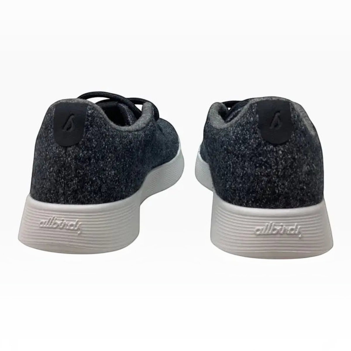 The Shoe Shop Allbirds Wool Runner sneakers in charcoal grey merino wool with white cushioned midsoles, back view.