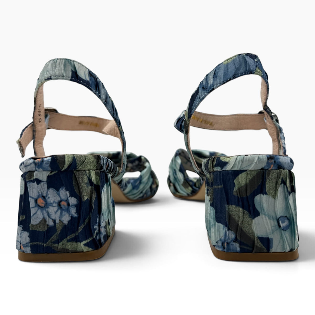 The Shoe Shop Aloof navy floral block heel sandals with a slingback strap, viewed from the back.