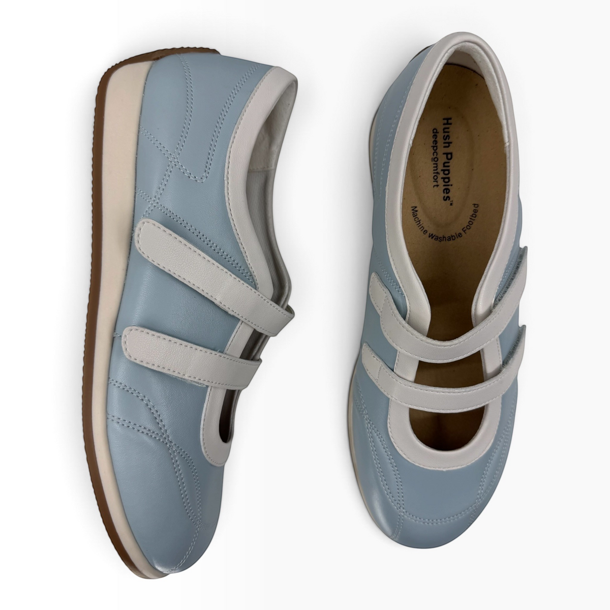 The Shoe Shop Amor flat in light blue leather with white trim, dual hook-and-loop straps, and a cushioned insole.