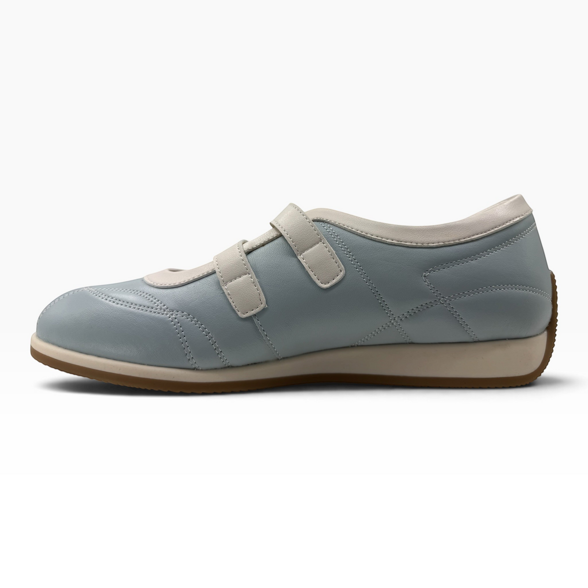 The Shoe Shop Amor flat in light blue leather with twin adjustable hook-and-loop straps and a rubber sole.