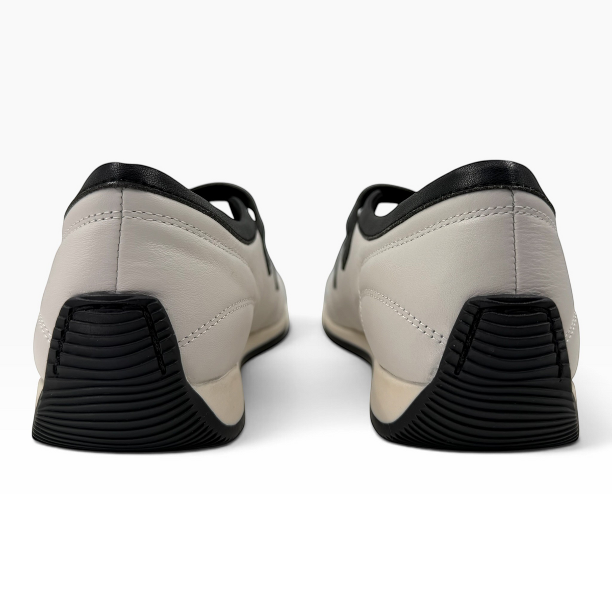The Shoe Shop Amor flat in grey and black leather with a supportive rubber heel and treaded sole, rear view.