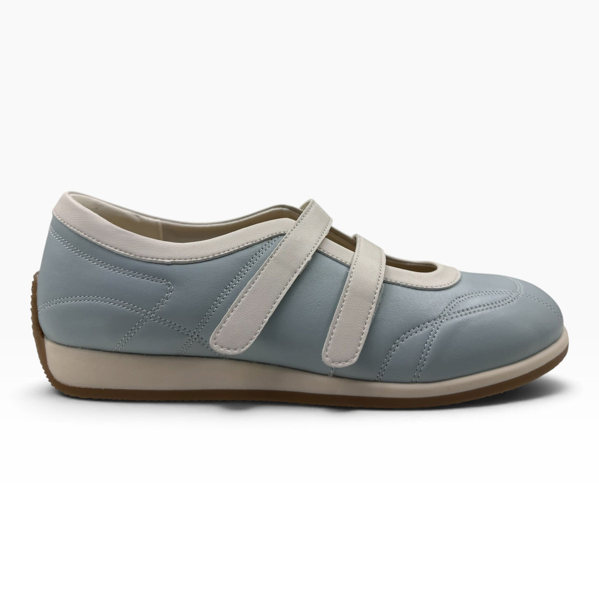 The Shoe Shop Amor flat in light blue leather with twin adjustable hook-and-loop straps and a cushioned rubber sole.