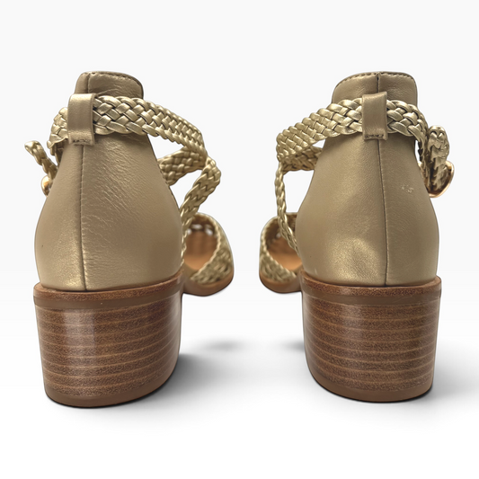 The Shoe Shop Anglo metallic gold leather sandals featuring a braided ankle strap and a low stacked wooden block heel.