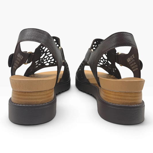 The Shoe Shop Ansh sandals in dark brown with laser-cut detailing, almond-toned footbed, and low block heel.