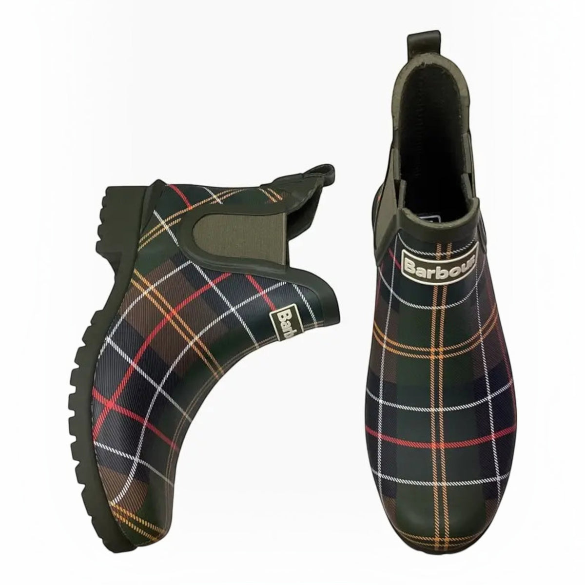 The Shoe Shop Barbour Wilton Chelsea Welly boots in olive green rubber with a signature tartan pattern and logo detail.