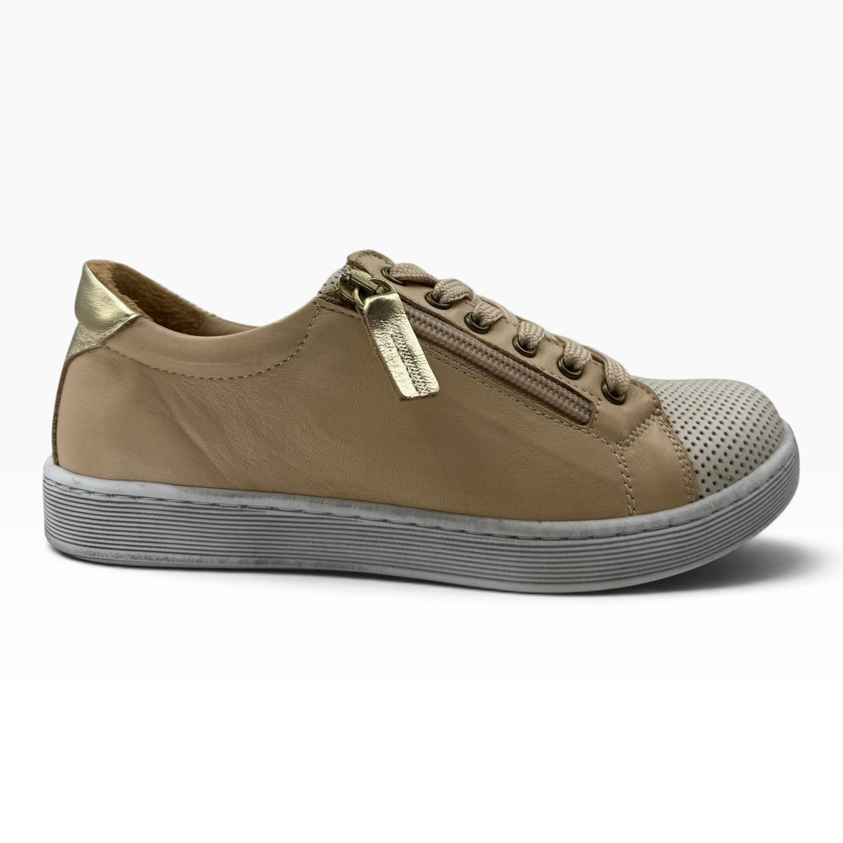 The Shoe Shop Tommie Perf sneaker in beige leather with perforated toe, side zip, and metallic gold heel detail.