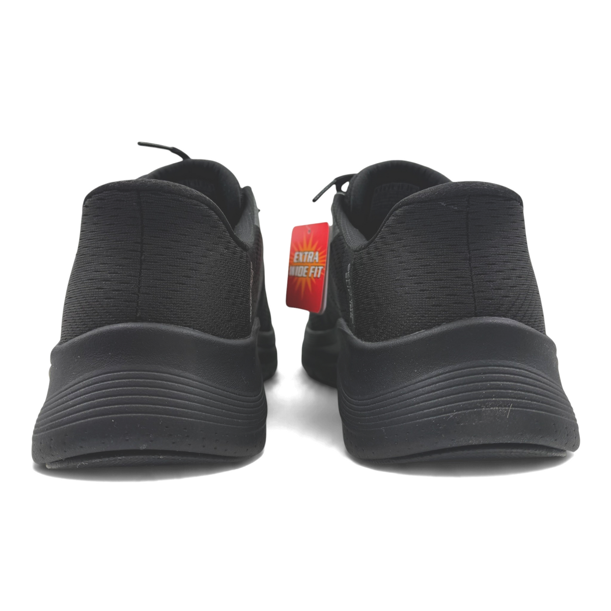 The Shoe Shop black extra wide fit athletic sneakers viewed from the back showing textured soles